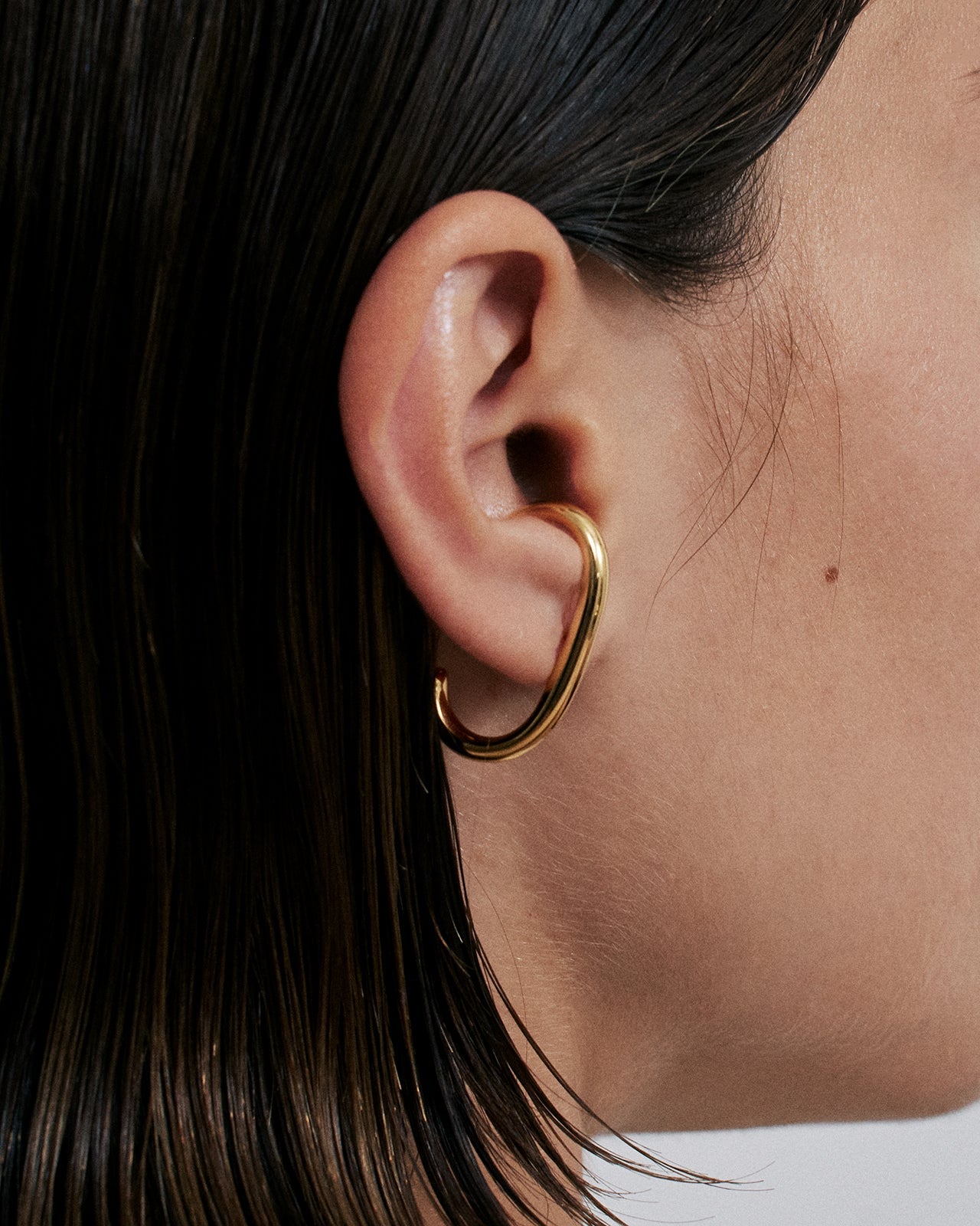 Minimalist Huggie Earrings In Gold Vermeil - Main Image