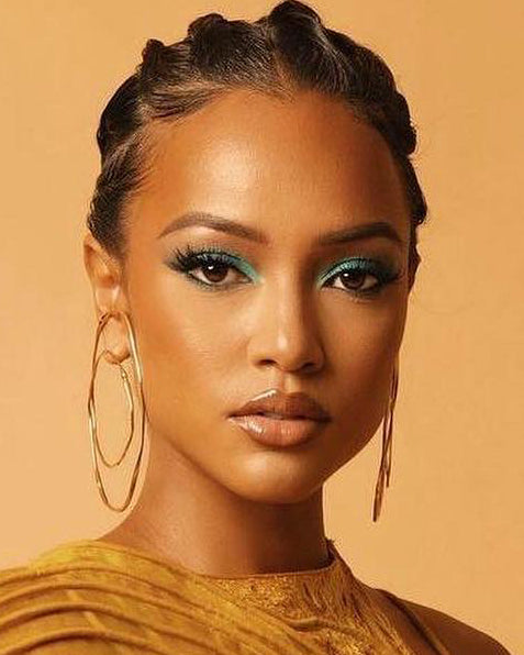 Karrueche is wearing Hope Double Hoop Earrings in Gold Vermeil during Black Panther: Wakanda Forever Premiere