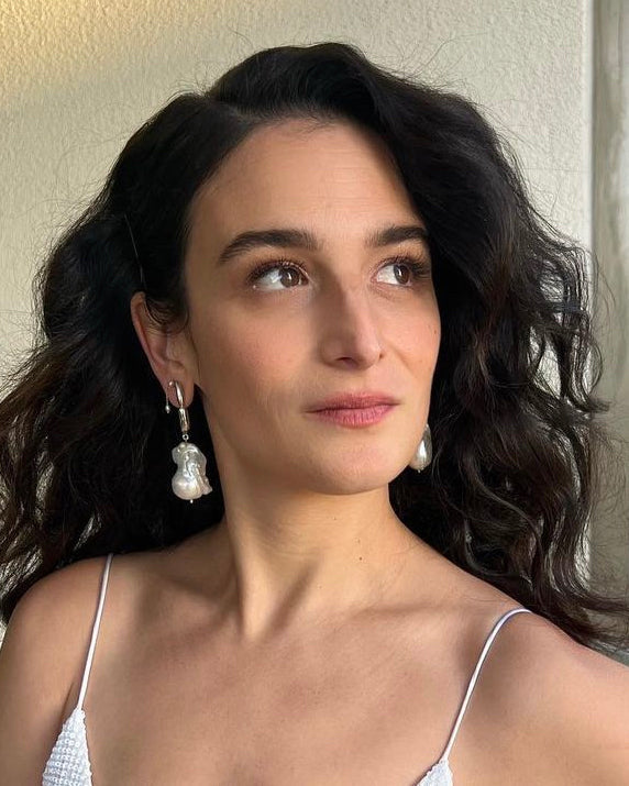 Jenny Slate is wearing Hope Pearl Drop Earrings, S Ring, White Pearl Hope Bracelet Jenny Slate for Academy of Motion Picture Arts and Sciences