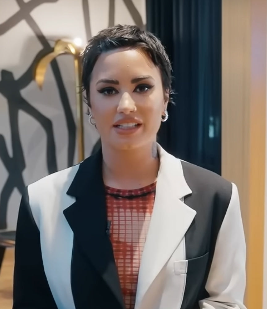 Demi Lovato is wearing Large Column Drum Hinged Hoop, Hope Double Ring, Flux Ring, Flux Minimalist Ring for Architectural Digest