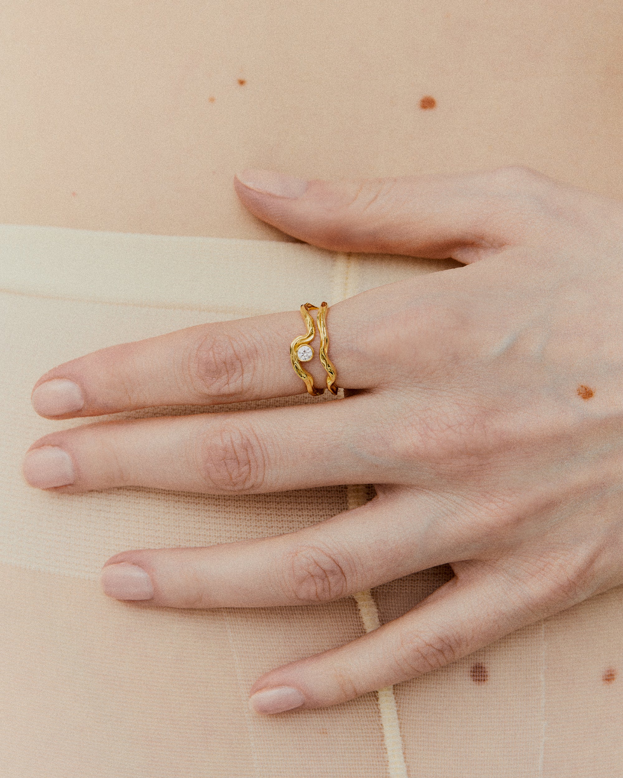 Contemporary solitaire ring in gold with diamond, offering a unique take on classic engagement ring styles
