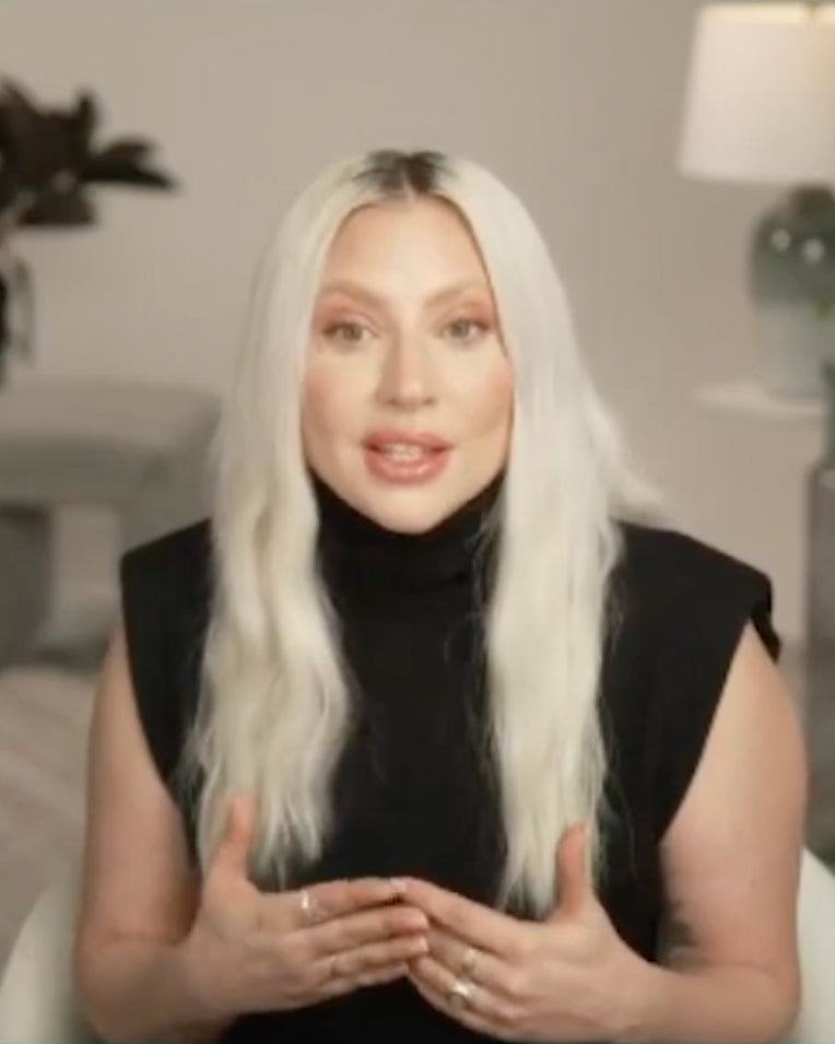 Lady Gaga wearing a black sleeveless top and Mara Paris Voyage Ring