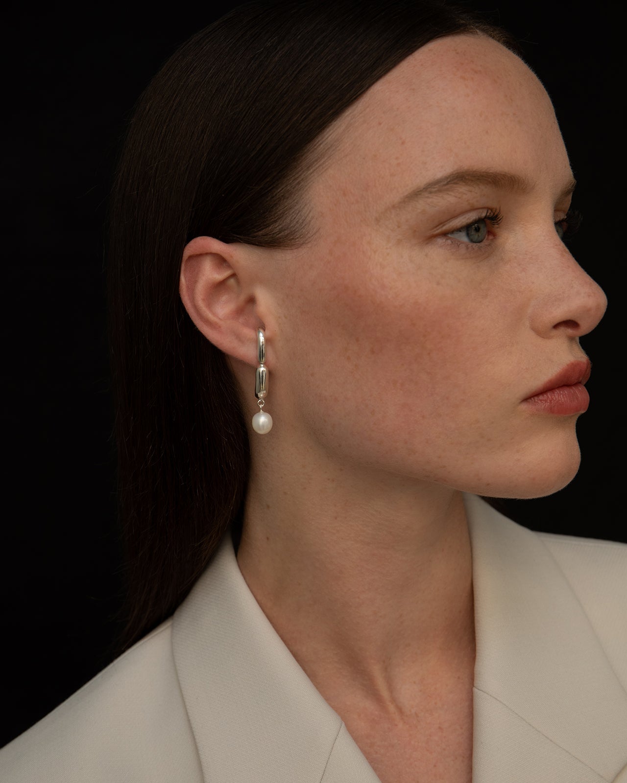 Hope Huggie Earrings With White Pearl Drop – Mara Paris