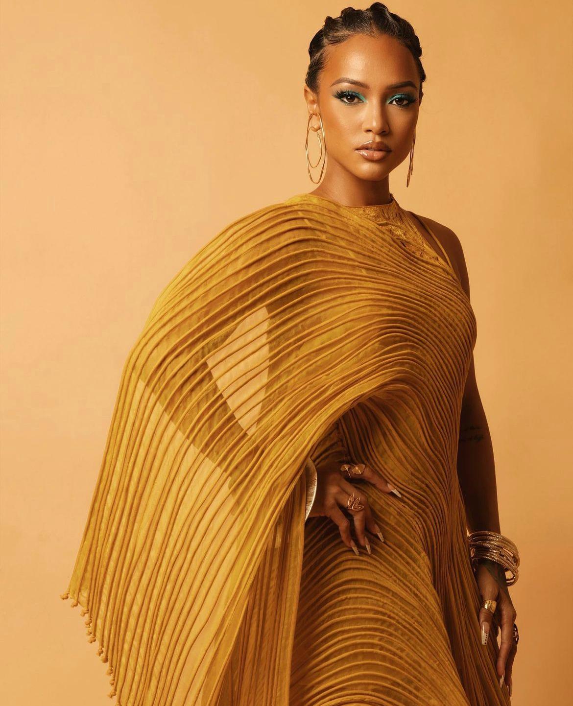 Karrueche is wearing Hope Double Hoop Earrings during Black Panther: Wakanda Forever Premiere